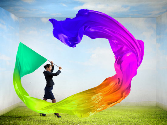 Woman waving colorful flag