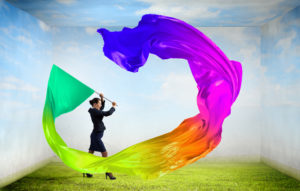 Woman waving colorful flag